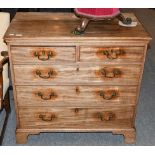 A George III mahogany four-height chest of drawers, with bronze drop handles, raised on brass