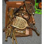 Three sets of brass fire irons, two pairs of andirons, two brass and steel clip on trivets, and a