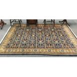 Indian rug of Perepdil design, the indigo field of rams horn motifs and flower heads enclosed by