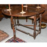 An oak 18th century gate leg table, 122cm by 107cm open by 73cm