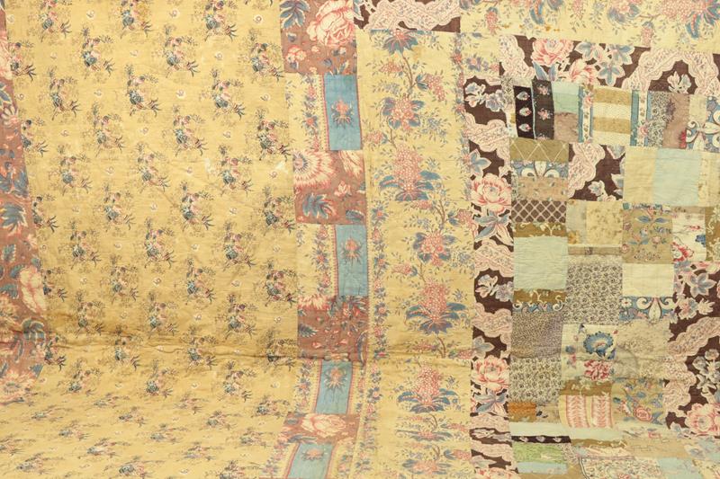 Mid 19th Century Patchwork Quilt, with a central patched square, alternating frames of solid