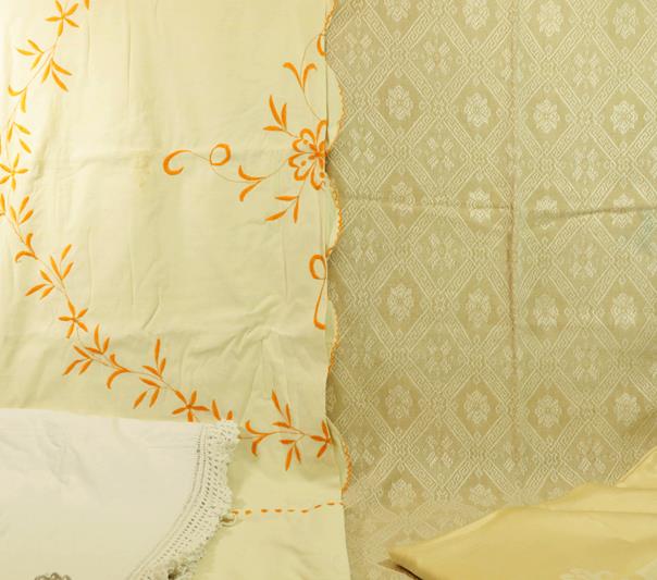 Assorted White Linens and Textiles, comprising a large yellow embroidered bed cover with a scalloped