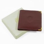 Cartier Burgundy Leather Wallet, stamped in gilt 'Cartier Paris, with authenticity card, gilt