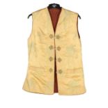 Early 20th Century Yellow Chinese Brocade Waistcoat, with toggle fastenings and a brown wool lining