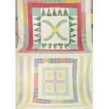 Early 20th Century Good Luck and Posterity Patchwork Quilt, with a central block of two appliqued