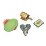 Assorted Sewing Accessories, comprising a gilt metal Swiss chalet tape measure, a Chinese