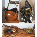 A brass warming pan, copper coal scuttle, large circular brass bowl, copper pan, brass circular