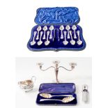 A collection of assorted silver, including: a cased set of 12 teaspoons with a pair of sugar-tongs