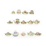 A quantity of mainly 19th century English porcelain miniature teapots, all decorated with applied