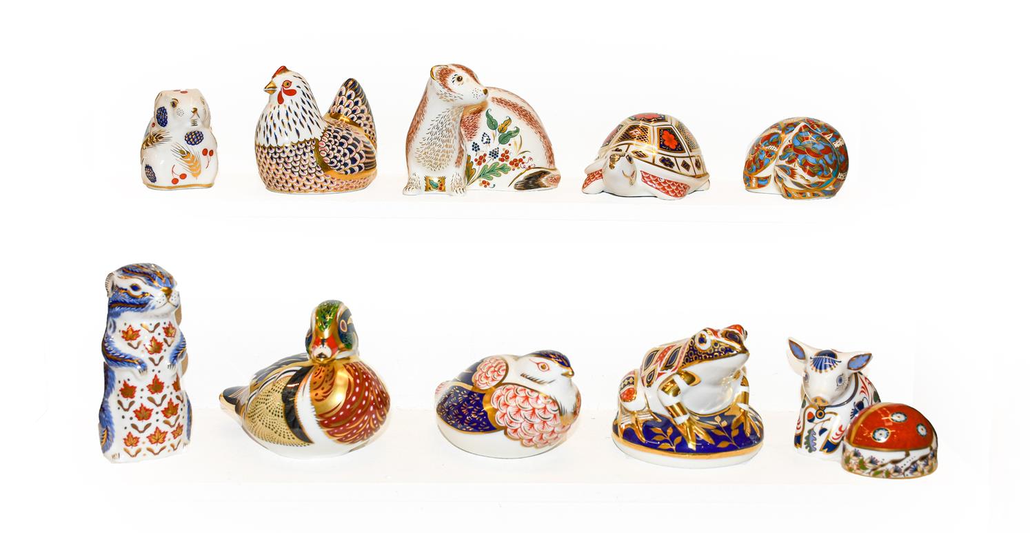 Eleven Royal Crown Derby Imari paperweights including Carolina Duck with gold stopper