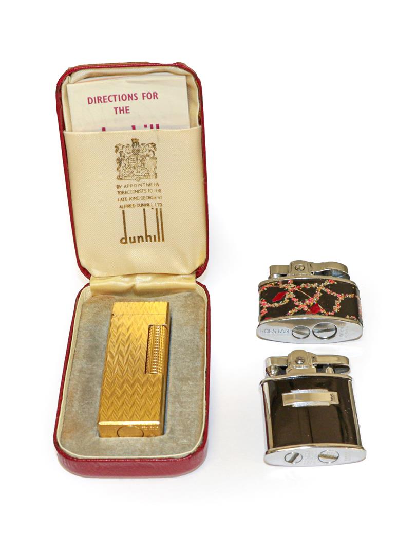 A Dunhill Rollagas cigarette lighter, cased, together with two further Ronson lighters
