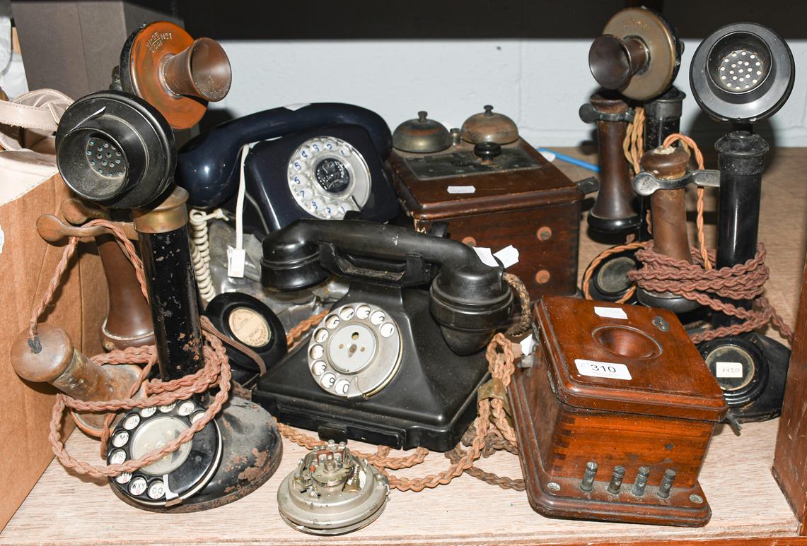 Four 1920s stick telephones, together with three bell boxes, another Bakelite telephone, and a
