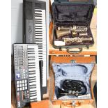 A Yamaha keyboard and an Akai keyboard, together with a cased clarinet, and a cased cornet