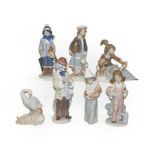 Eight Lladro figures including a clown playing a saxophone