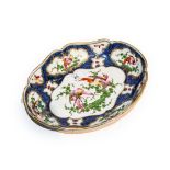 A Samson of Paris 19th century Worcester style dish, scale blue ground and painted with exotic