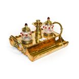 A Victorian brass Gothic revival desk stand in the manner of A W N Pugin, together with a pair of