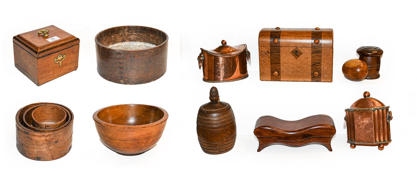 A Georgian mahogany tea caddy, a large treen bowl, a nest of wooden measures and a quantity of other