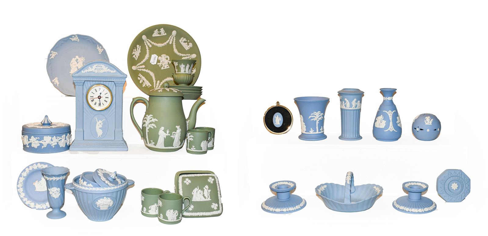 A quantity of Wedgwood Jasperware in blue and green, including a mantel clock, vases and trinket