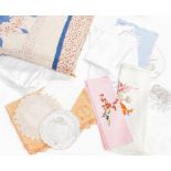 A modern patchwork quilt, a white cotton knitted bed cover, assorted white linen, embroidered linen,