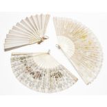 Two similar 19th century ivory fans with pierced and carved sticks and guards, both with fabric