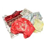 Assorted lengths of dress fabric, textiles, woven and embroidered red velvet panels etc (two boxes)