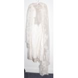 Circa 1960's possibly Christian Dior wedding dress, white sleeveless dress with lace mount and