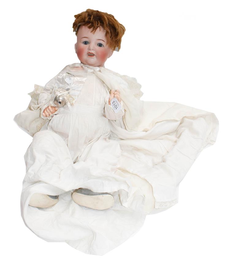 A Simon & Halbig 126 doll in a white cotton dress, together with a silver and mother of pearl