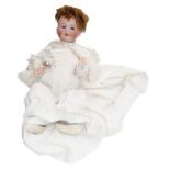 A Simon & Halbig 126 doll in a white cotton dress, together with a silver and mother of pearl