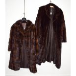 A long dark mink coat, together with another smaller (2)