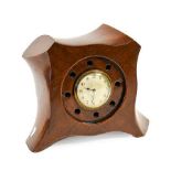 A Laminated Mahogany Mantel Timepiece, made from the centre of a First World War 4 bladed