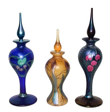 Okra glass, comprising: three iridescent scent bottles, one titled Viola 30/500, 24cm, one title