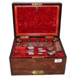 A Victorian rosewood fitted travelling vanity box with an assembled set of silver, silver plate