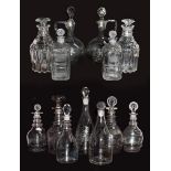 A pair of cut glass decanters engraved 'Holland and Shrub', together with another pair of decanters,