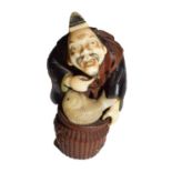 A Japanese Meiji period carved wood and ivory shibayama netsuke in the form of a fishmonger, signed