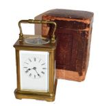 A brass striking carriage clock, circa 1900, with twin barrelled movement and later platform