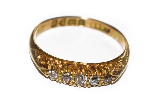 An 18 carat gold diamond five stone ring, the graduated old cut diamonds in yellow claw settings