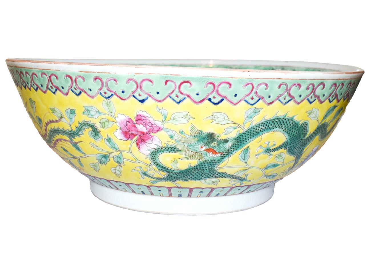 An early 20th century Chinese yellow ground porcelain bowl, decorated with dragons and a phoenix, - Image 4 of 24