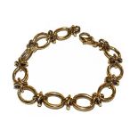 A fancy link bracelet, clasp stamped '375', length 20.5cm . Gross weight 25.7 grams.