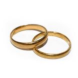 Two 22 carat gold band rings, finger sizes K1/2 and L1/2. Gross weight 4.9 grams.