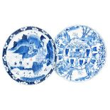 A Chinese Kangxi blue and white dish with lappet moulded border, painted with landscapes and