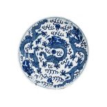 A 19th century Chinese blue and white dish, painted with dragons chasing pearls on grounds of