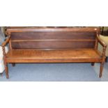 A Regency mahogany bench raised on turned supports, 183cm by 50cm by 87cm