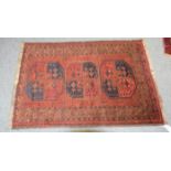 Afghan Turkmen Rug, the field with three elephant foot guls enclosed by narrow boteh borders,