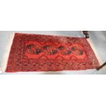 Afghan Turkman rug, the field with four elephant foot guls enclosed by multiple borders, 206cm by