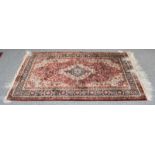 Chinese silk rug, the fox brown field of scrolling vines centred by a flower head medallion framed