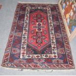 Dosemealti rug, the crimson field with three cruciform medallions enclosed by indigo borders and