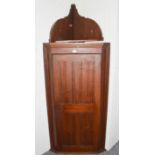 An large oak hanging corner cupboard with additional bracket supports, 73cm by 48cm by 155cm, and an