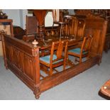 A French oak three-quarter bed with carved arch top pediment, turned finials and reeded mouldings,