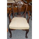 A Hepplewhite style carved mahogany armchair on claw and ball feet