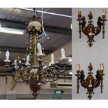 A hanging six-branch gilt metal chandelier with scrolling arms, formed as Blackamoor caryatids,